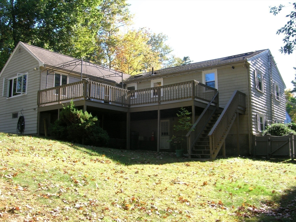 223 Robert Road Dedham, MA 02026 - Photo 18 of 18 a view of a house with a yard