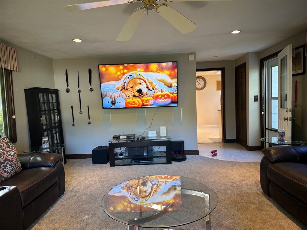 223 Robert Road Dedham, MA 02026 - Photo 8 of 18 a living room with furniture and a flat screen tv