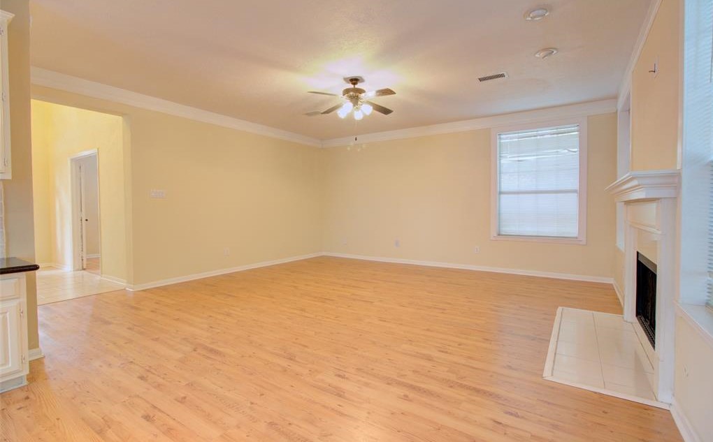 1226 Rabbs Crossing Sugar Land, TX 77479 - Photo 23 of 50 wooden floor in an empty room with a window