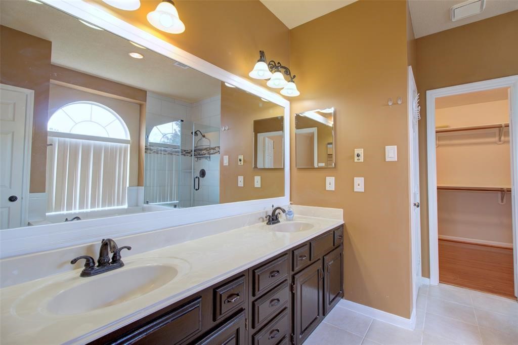 1226 Rabbs Crossing Sugar Land, TX 77479 - Photo 28 of 50 a bathroom with a double vanity sink and a mirror