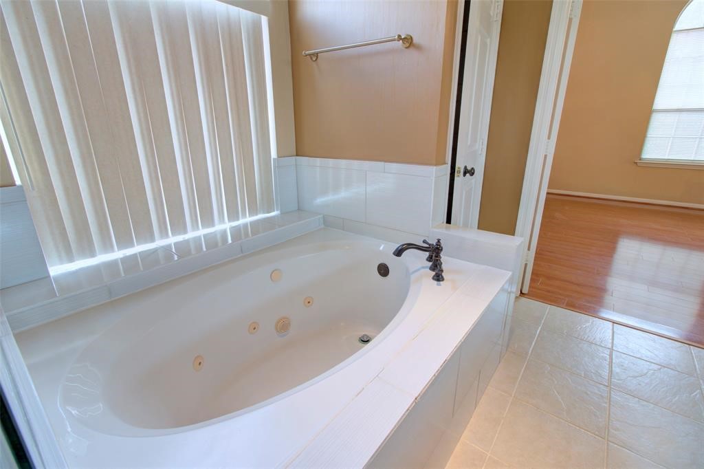 1226 Rabbs Crossing Sugar Land, TX 77479 - Photo 32 of 50 a bathroom with bathtub and shower