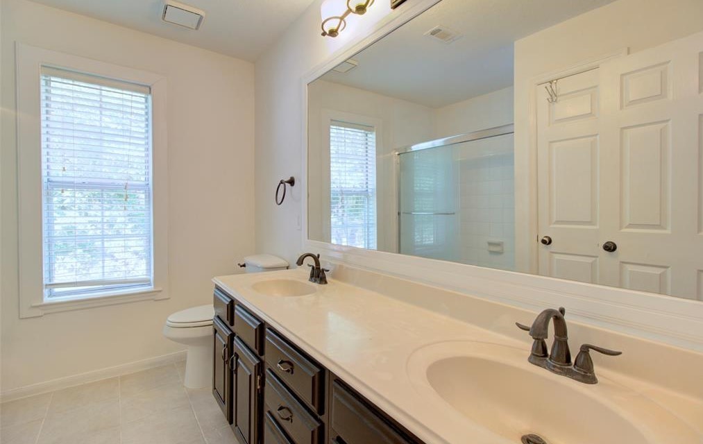 1226 Rabbs Crossing Sugar Land, TX 77479 - Photo 45 of 50 a bathroom with a sink double vanity and a bathtub