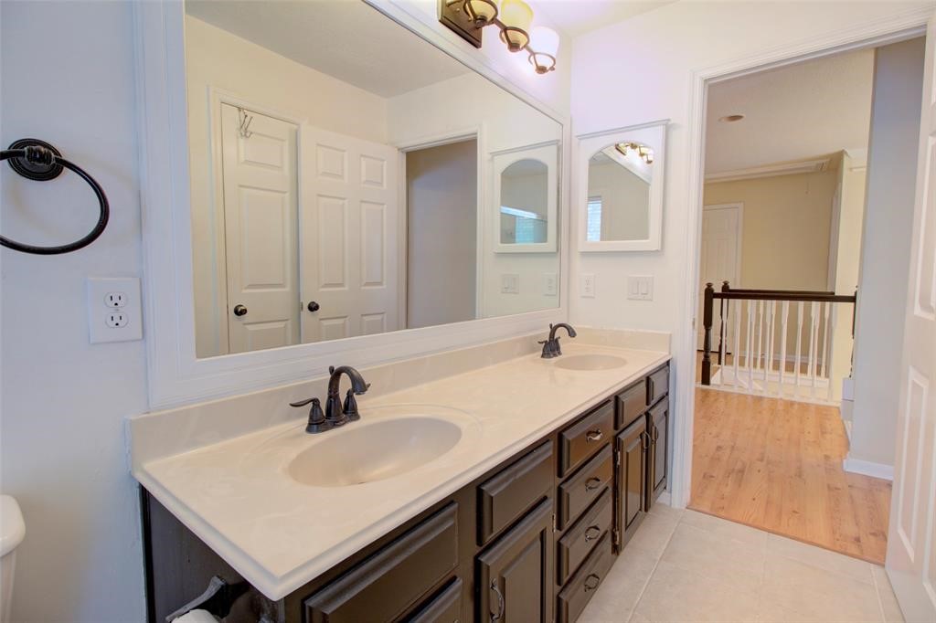 1226 Rabbs Crossing Sugar Land, TX 77479 - Photo 46 of 50 a bathroom with a sink and a mirror