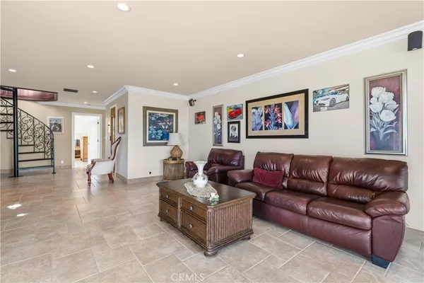a kitchen with stainless steel appliances granite countertop a sink a stove and a wooden cabinets