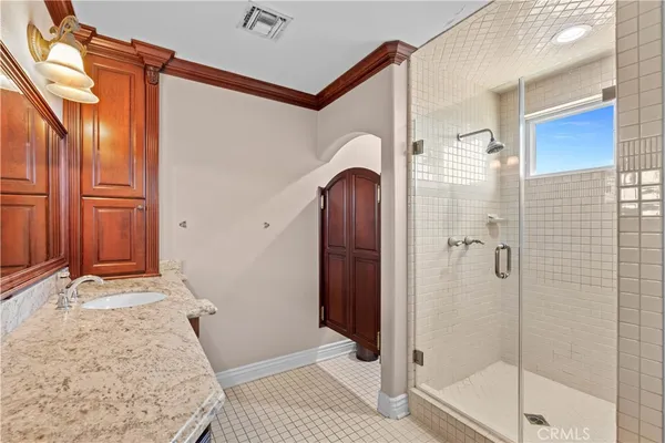 a bathroom with a double vanity sink mirror and toilet