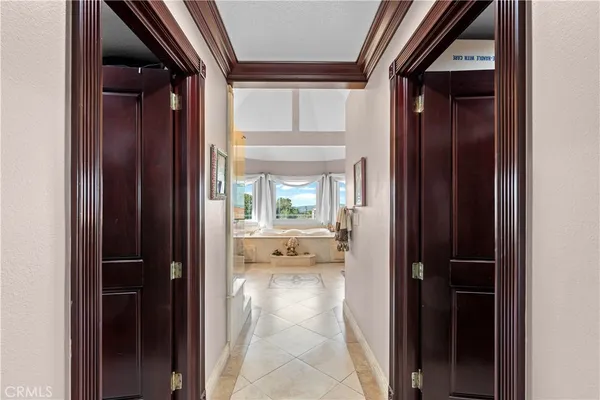 a view of a patio with a table chairs and garden
