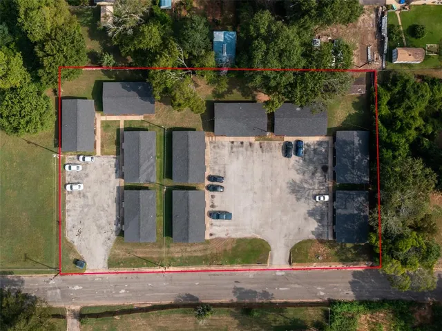 aerial view of a house with large trees