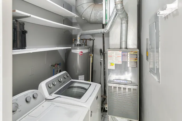 a kitchen with a refrigerator sink and cabinets