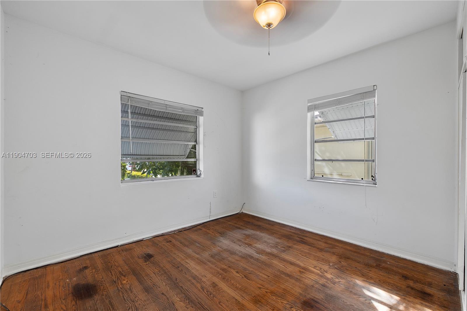 8826 Emerson Avenue Surfside, FL 33154 - Photo 14 of 25 an empty room with a window
