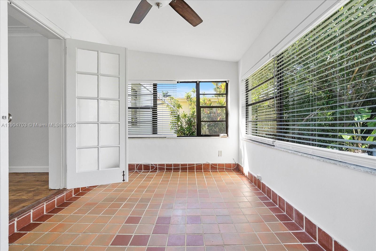 8826 Emerson Avenue Surfside, FL 33154 - Photo 19 of 25 a view of an empty room with a window