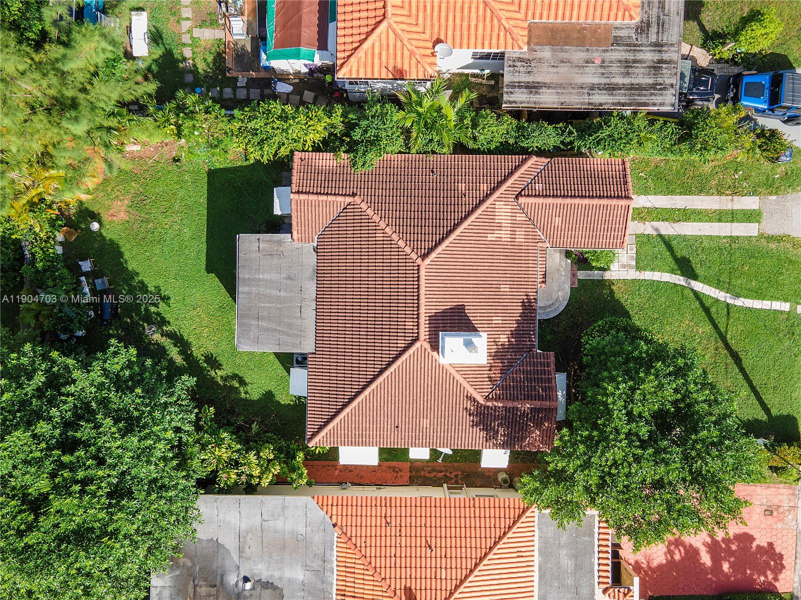 8826 Emerson Avenue Surfside, FL 33154 - Photo 20 of 25 an aerial view of a house with a yard and potted plants