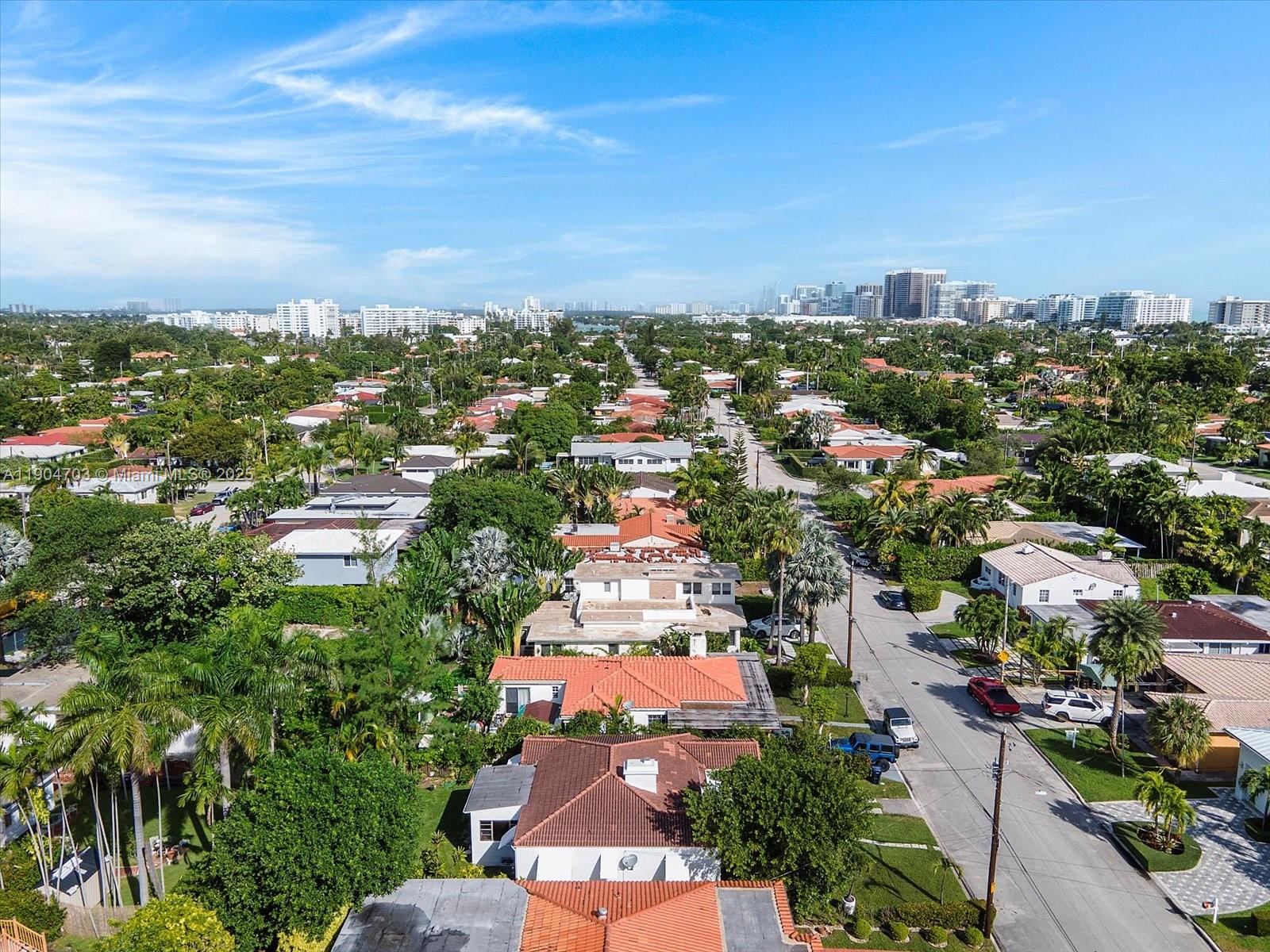 8826 Emerson Avenue Surfside, FL 33154 - Photo 22 of 25 an aerial view of residential building with green space