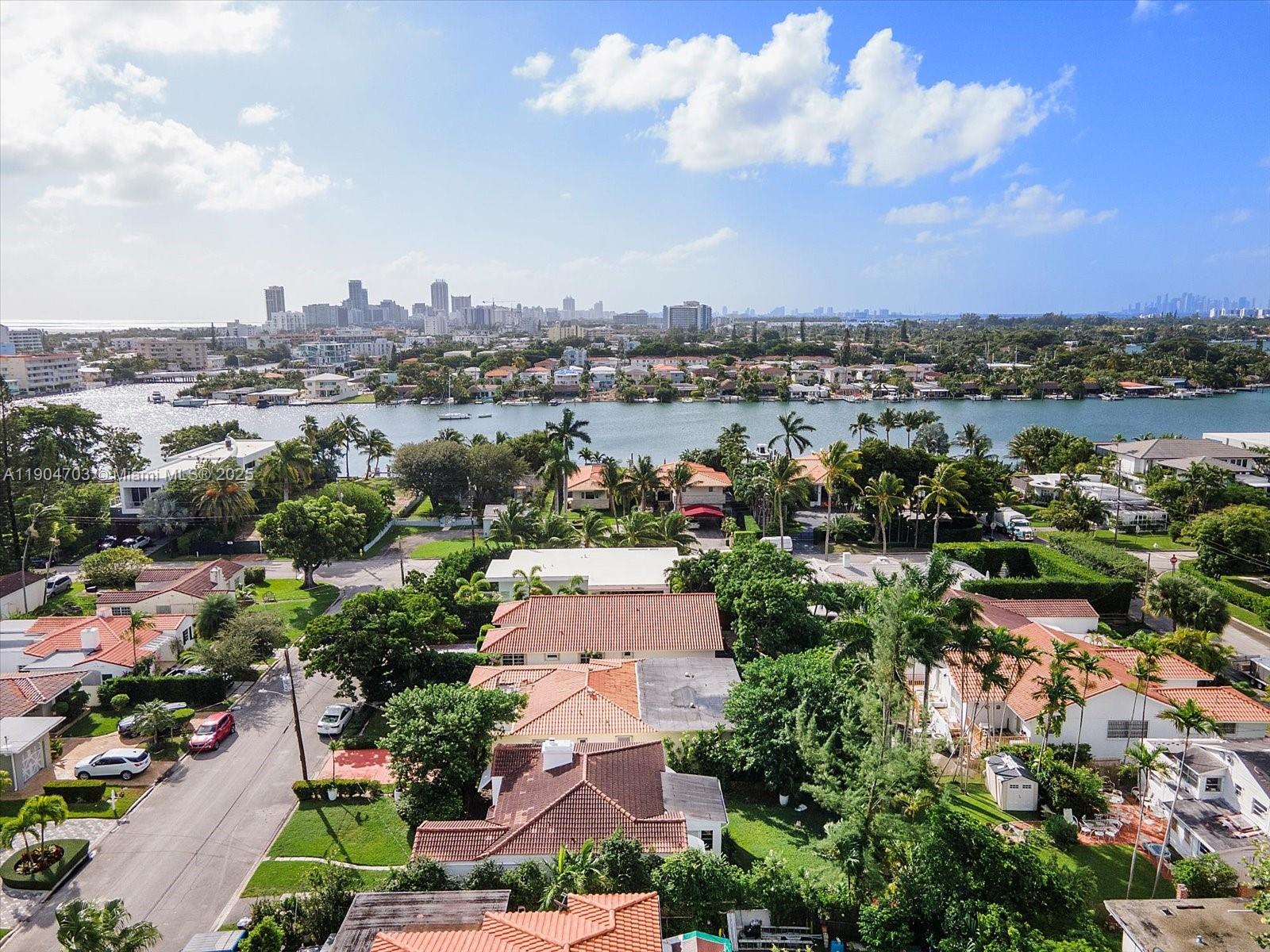 8826 Emerson Avenue Surfside, FL 33154 - Photo 24 of 25 an aerial view of a city with lots of residential buildings ocean and mountain view in back
