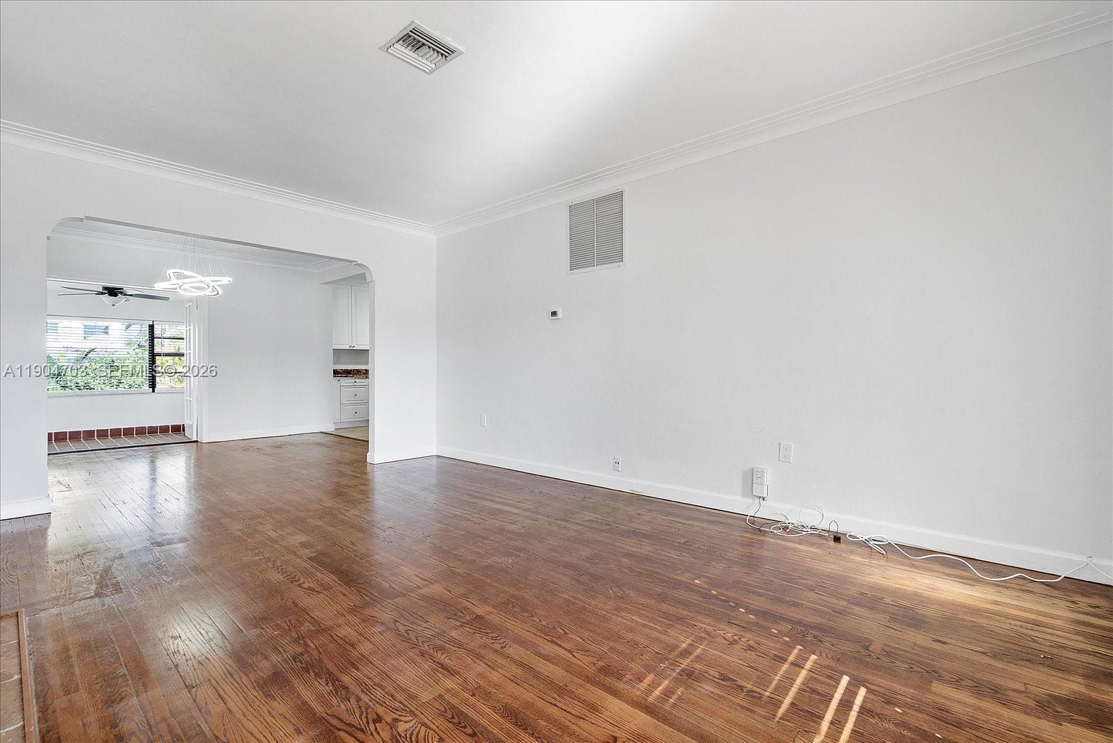 8826 Emerson Avenue Surfside, FL 33154 - Photo 7 of 25 wooden floor in an empty room