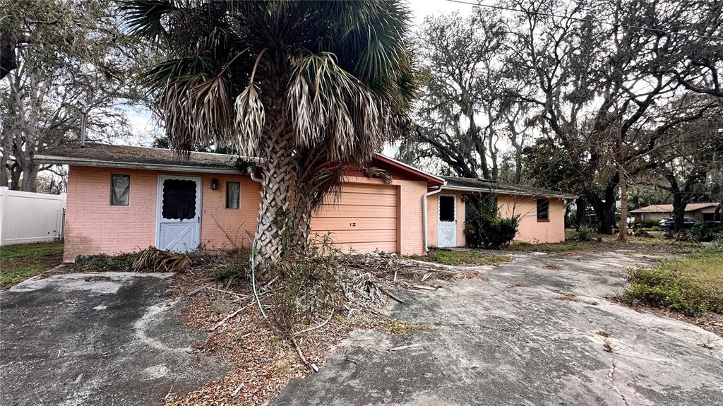 a house is sitting in middle of forest
