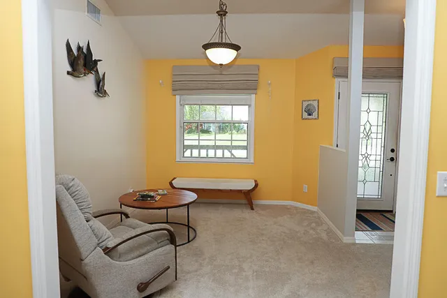 a view of a livingroom with furniture and windows