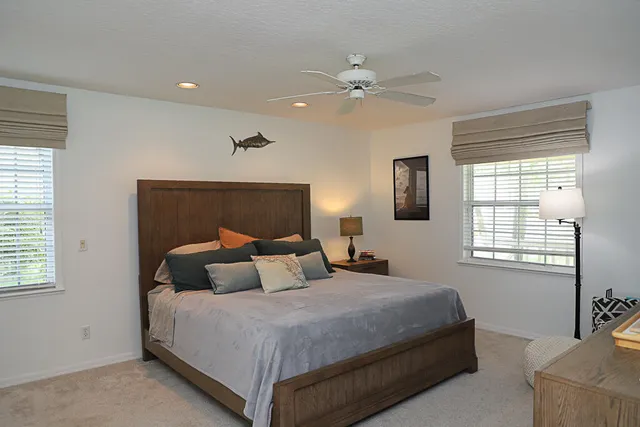 a bedroom with bed and window