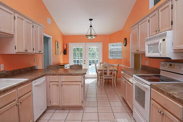 a kitchen with cabinets appliances and a counter top space