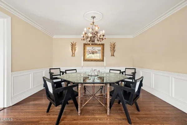 a view of a dining room with furniture window and wooden floor