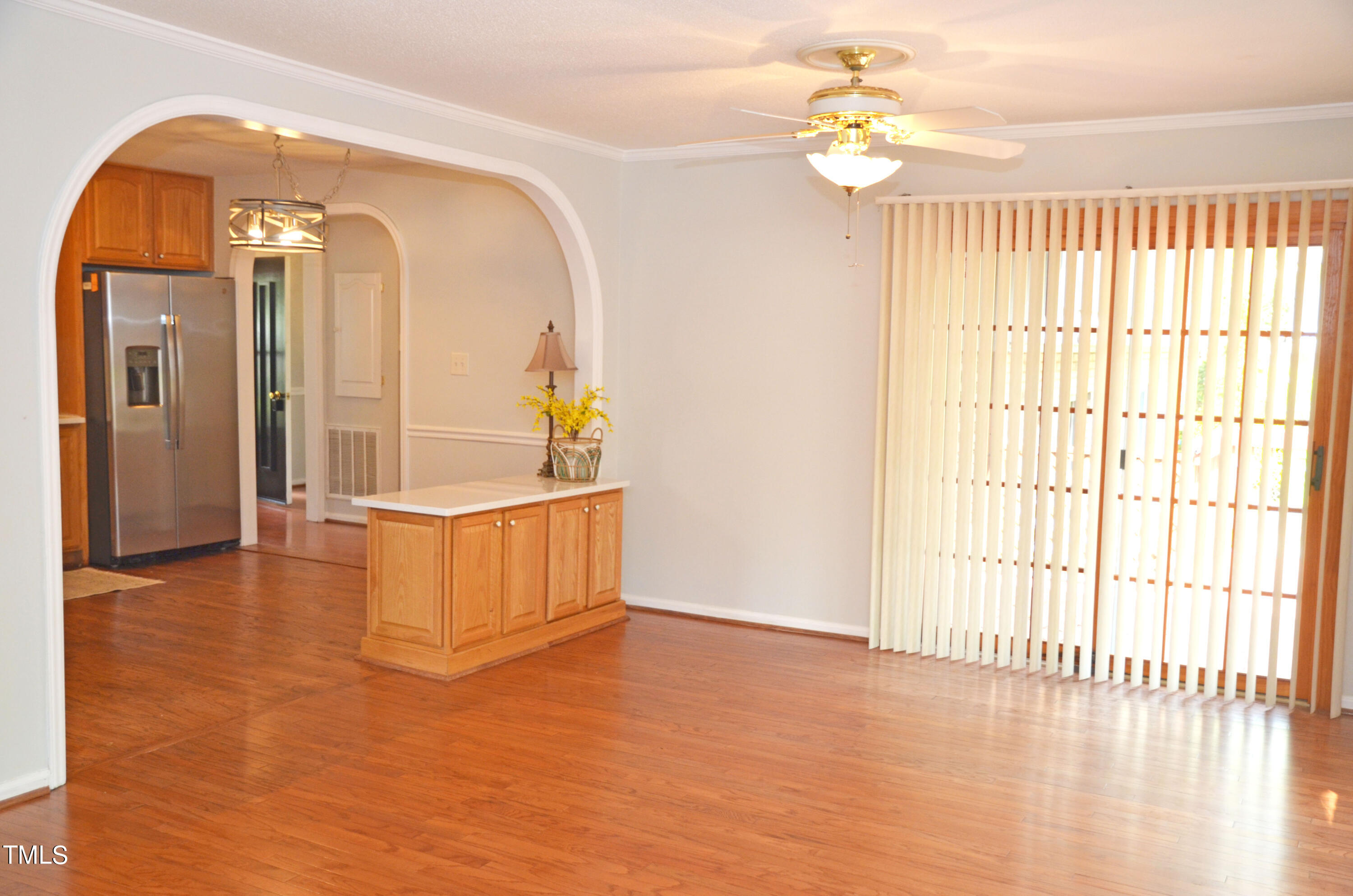 5708 Old Forge Circle Raleigh, NC 27609 - Photo 12 of 31 a view of an empty room with window and wooden floor