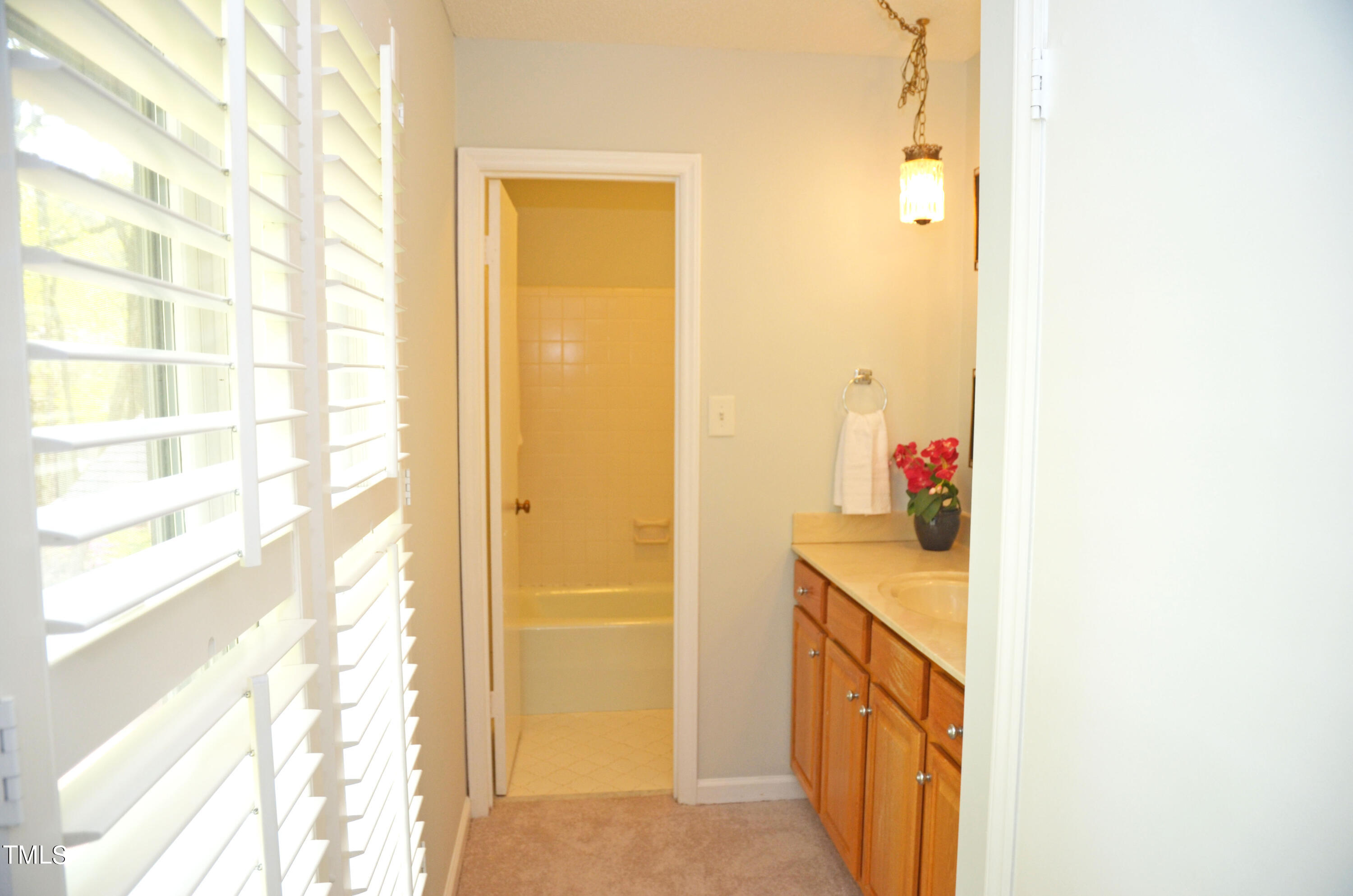 5708 Old Forge Circle Raleigh, NC 27609 - Photo 19 of 31 a bathroom with a sink and a mirror
