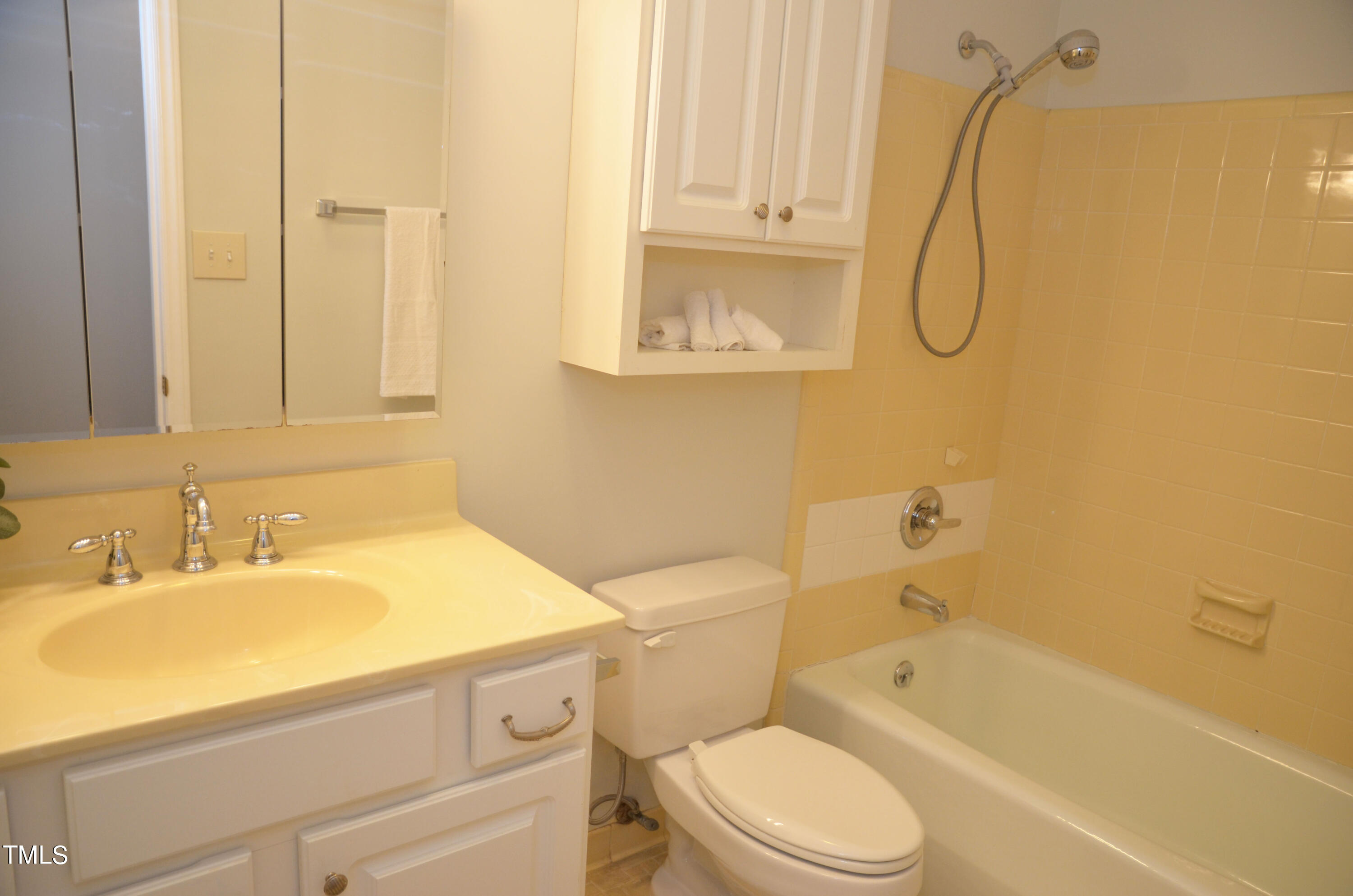 5708 Old Forge Circle Raleigh, NC 27609 - Photo 25 of 31 a bathroom with a sink a toilet and shower