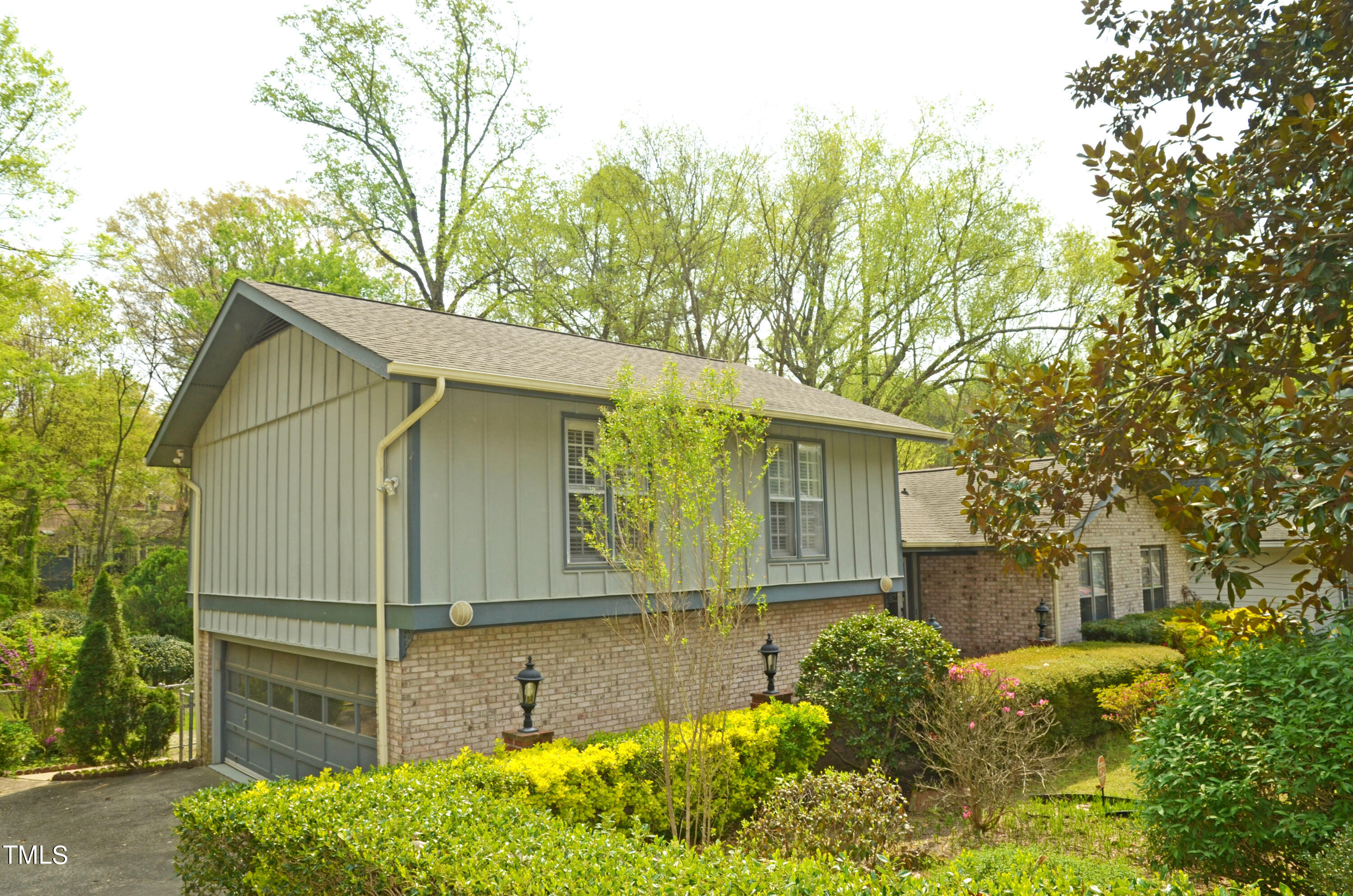 5708 Old Forge Circle Raleigh, NC 27609 - Photo 27 of 31 a front view of a house with garden