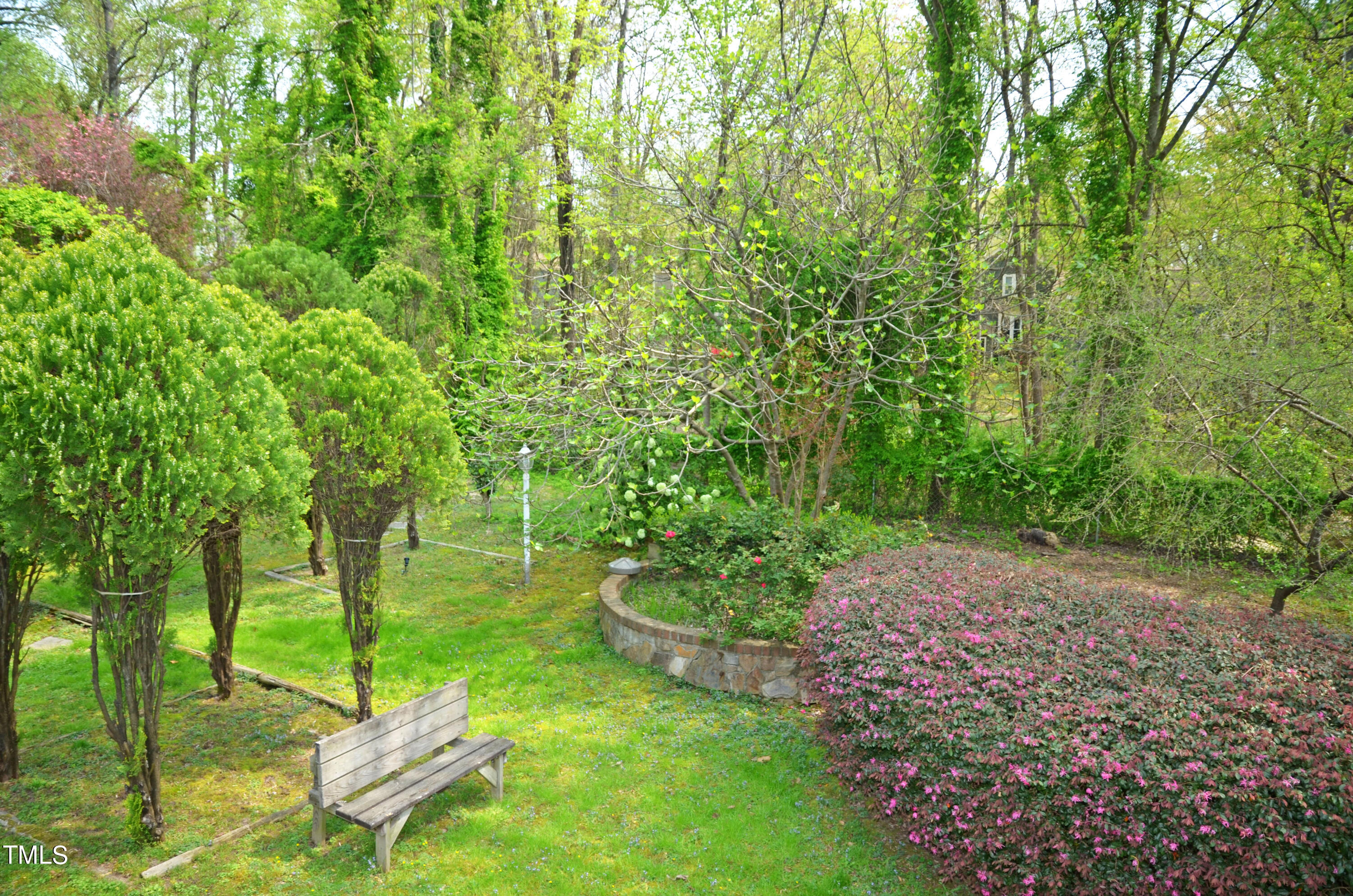 5708 Old Forge Circle Raleigh, NC 27609 - Photo 30 of 31 a view of a backyard with table and chairs