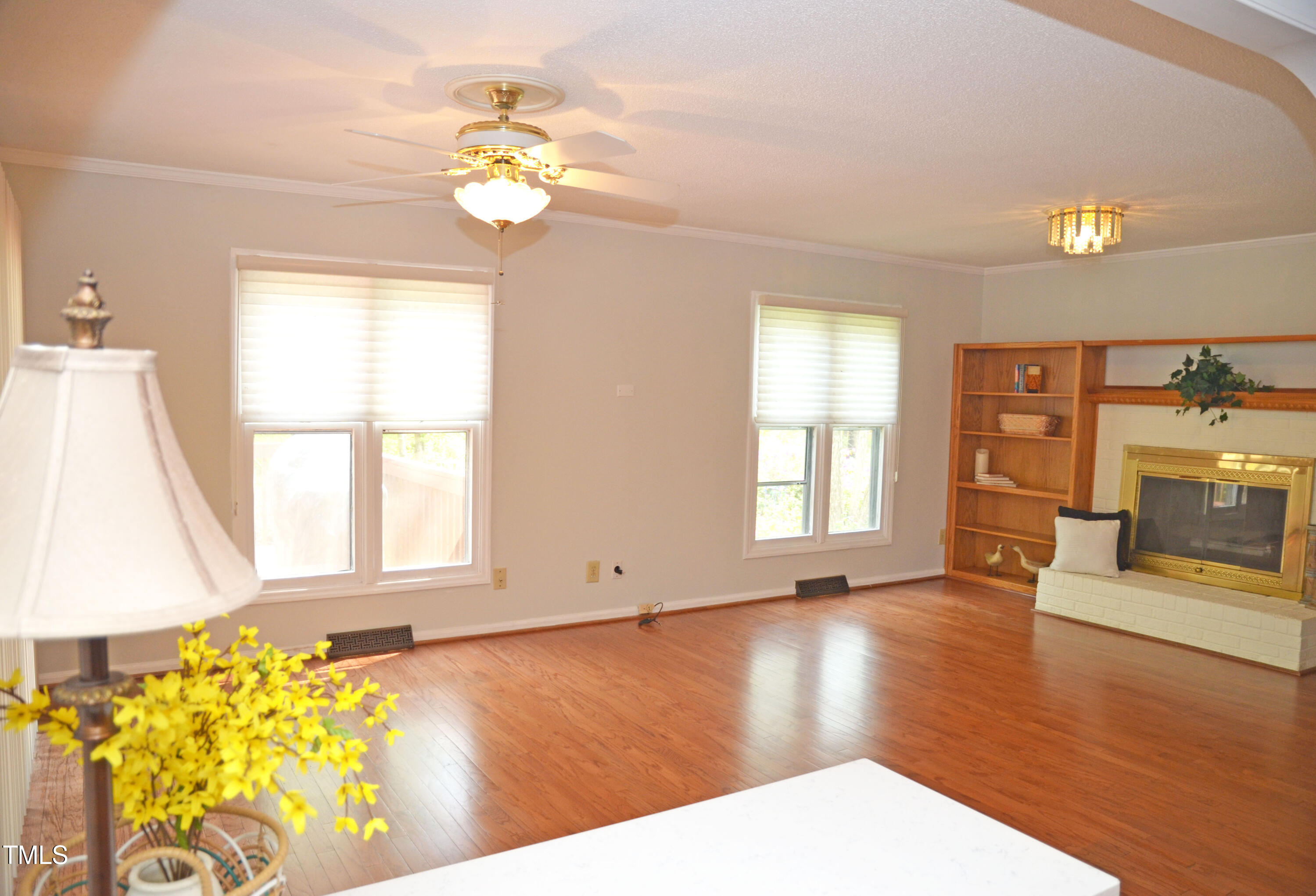 5708 Old Forge Circle Raleigh, NC 27609 - Photo 3 of 31 a view of an empty room with wooden floor and a window