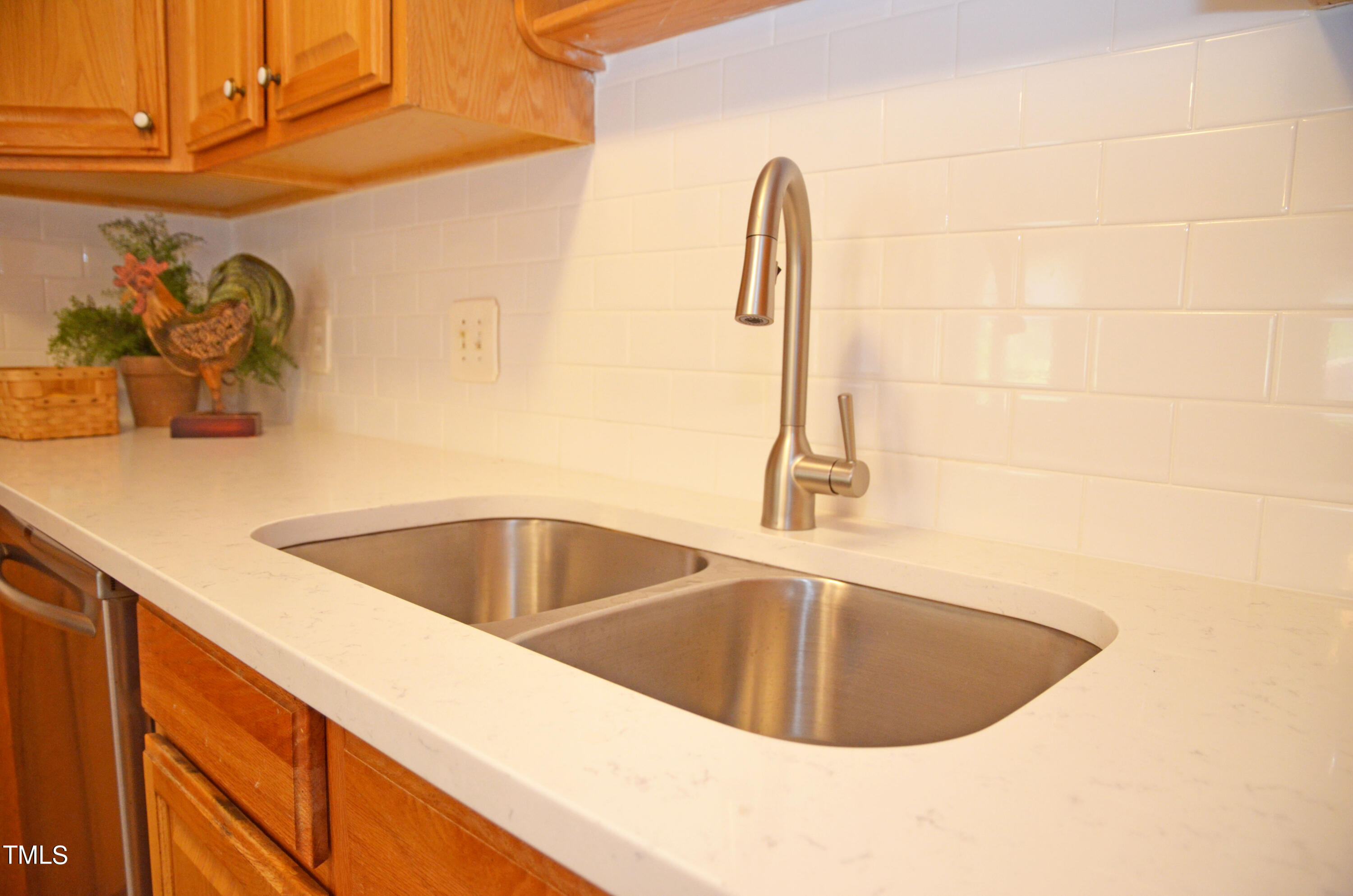 5708 Old Forge Circle Raleigh, NC 27609 - Photo 8 of 31 a view of a sink a faucet and appliance in the kitchen