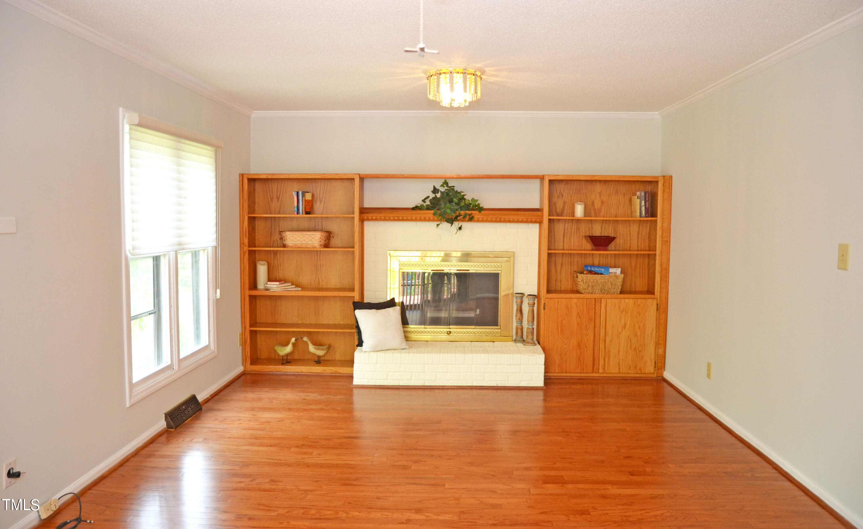 5708 Old Forge Circle Raleigh, NC 27609 - Photo 9 of 31 a living room with furniture and a large window