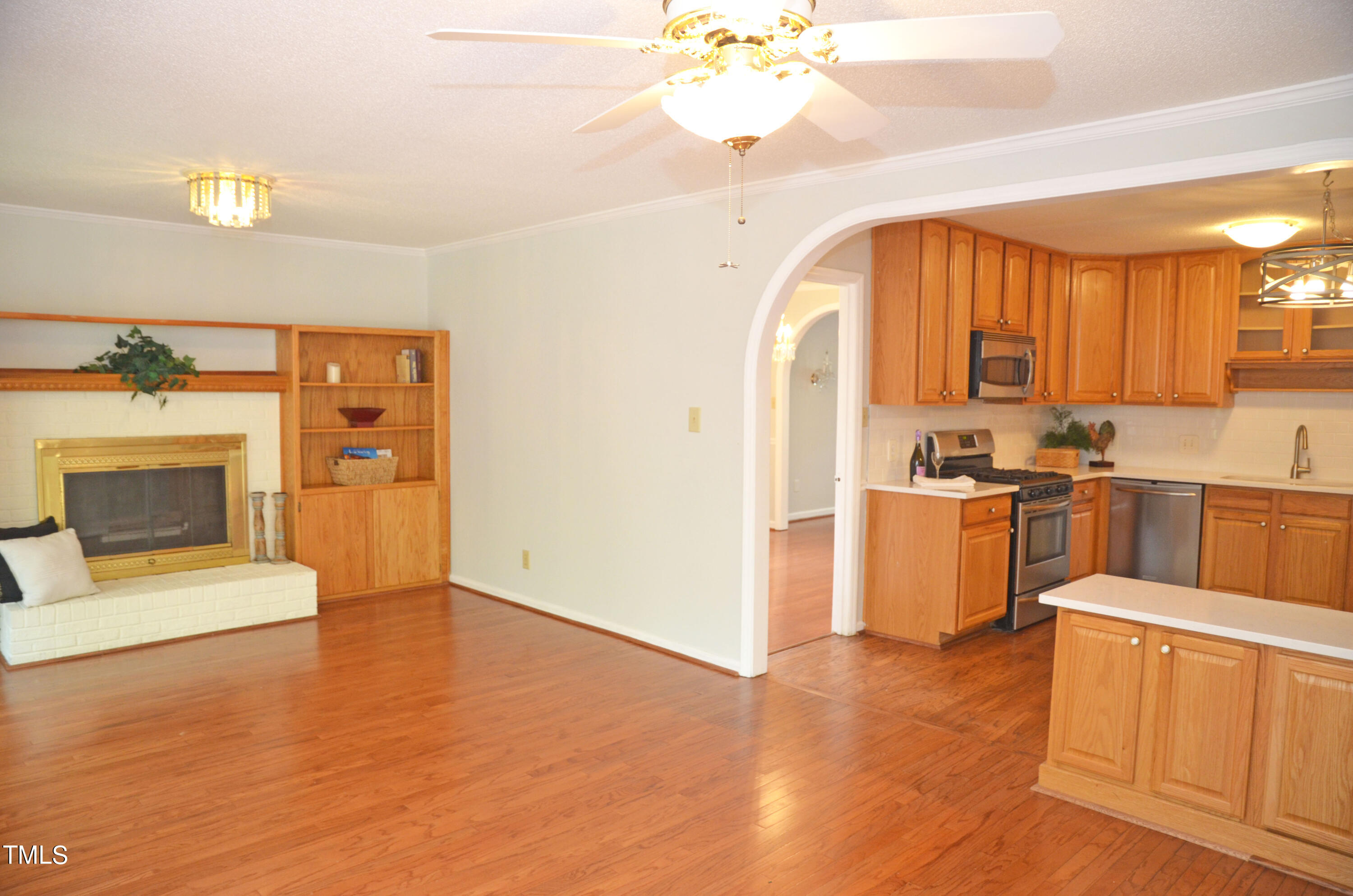 5708 Old Forge Circle Raleigh, NC 27609 - Photo 10 of 31 a view of a kitchen with a sink cabinets and a living room