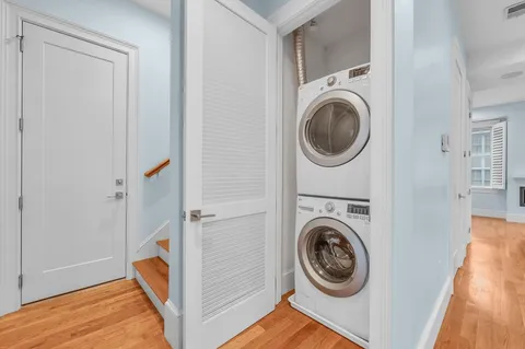 a view of a hallway with washer and dryer