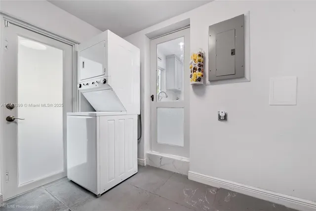 a view of a bedroom with bed and wooden floor