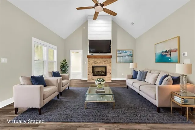a living room with furniture fireplace and a flat screen tv