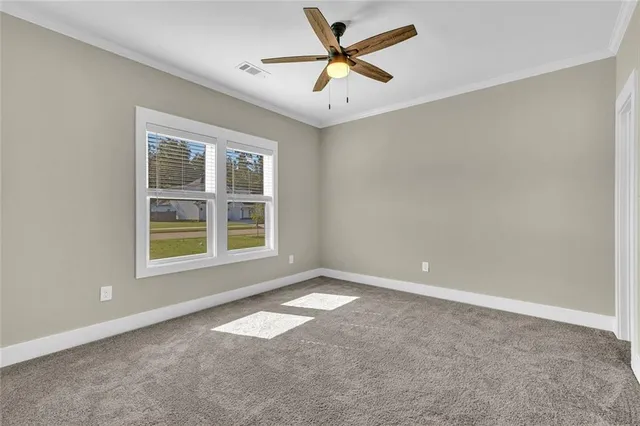 a view of a room with a ceiling fan