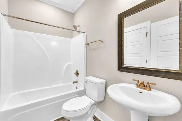 a bathroom with a bathtub and shower