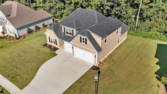 an aerial view of a house with swimming pool