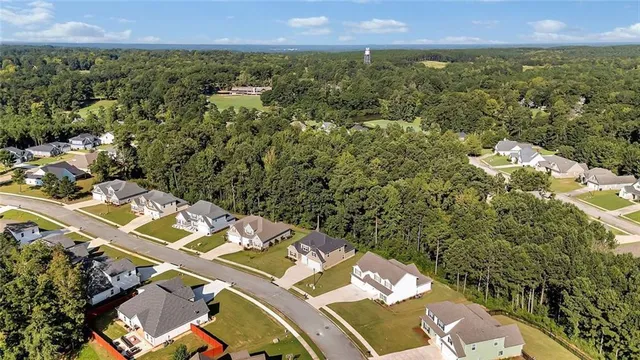 an aerial view of a house with a yard