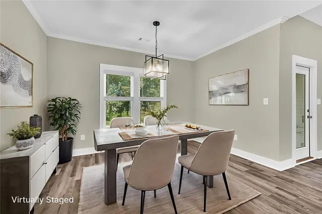 a view of a dining room with furniture window and wooden floor