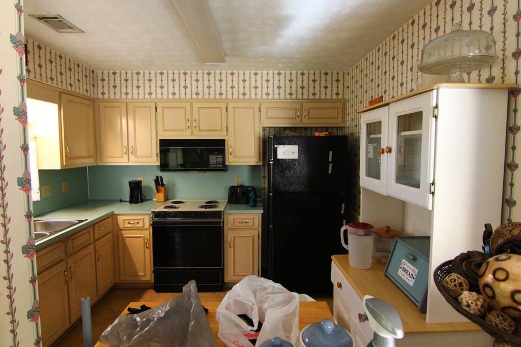 4379 Reesewood Court Columbus, GA 31907 - Photo 8 of 12 a kitchen with stainless steel appliances a stove a sink and a refrigerator