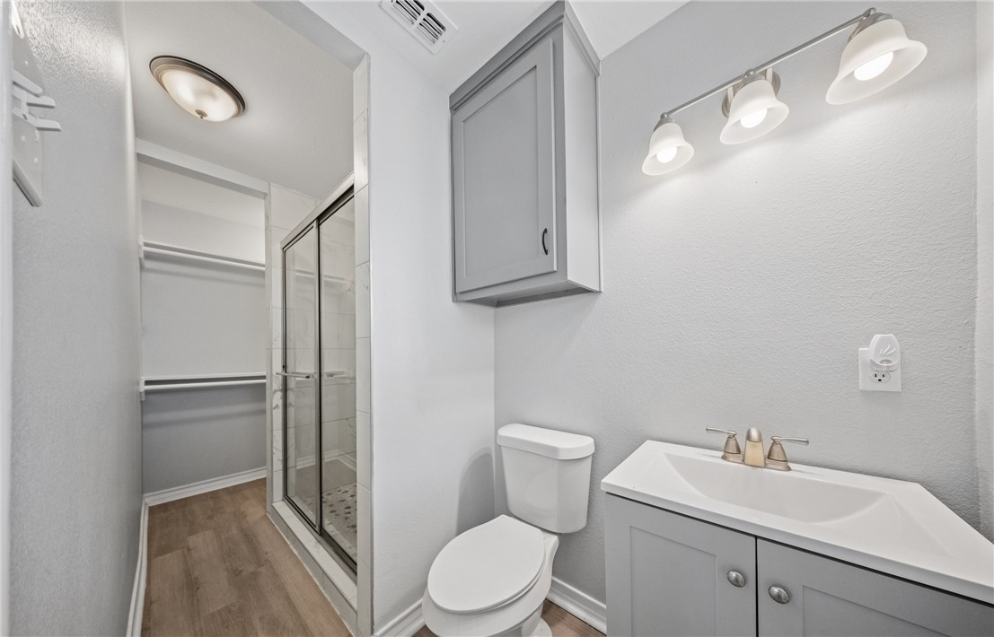 1333 Prince Drive Corpus Christi, TX 78412 - Photo 14 of 20 a white toilet sitting next to a bathroom sink