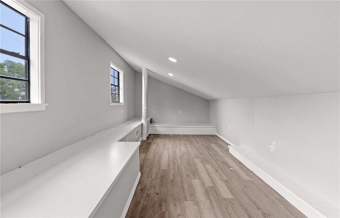 1333 Prince Drive Corpus Christi, TX 78412 - Photo 18 of 20 wooden floor in an empty room with a window