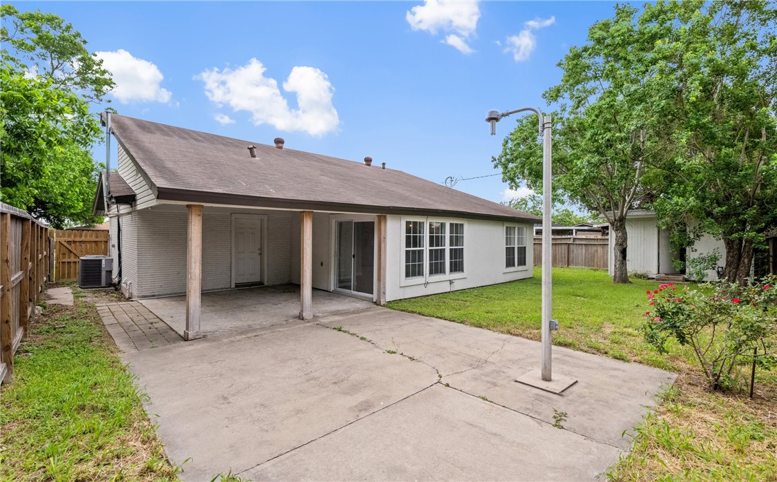 1333 Prince Drive Corpus Christi, TX 78412 - Photo 20 of 20 a view of a house with a backyard and a large tree