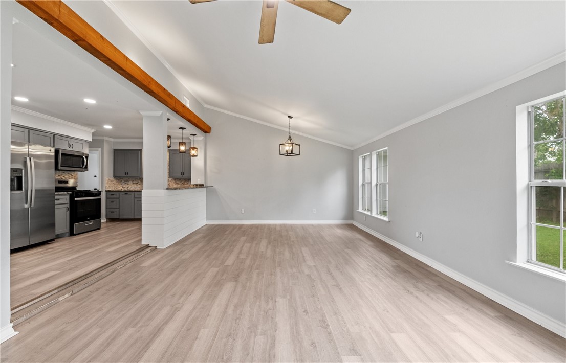 1333 Prince Drive Corpus Christi, TX 78412 - Photo 7 of 20 a view of a big room with wooden floor and windows