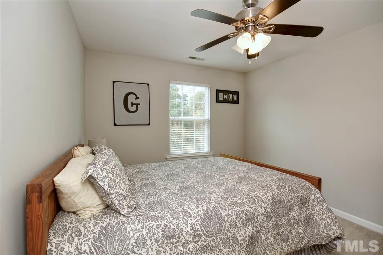 927 Ileagnes Road Raleigh, NC 27603 - Photo 15 of 26 a bedroom with a bed and a window