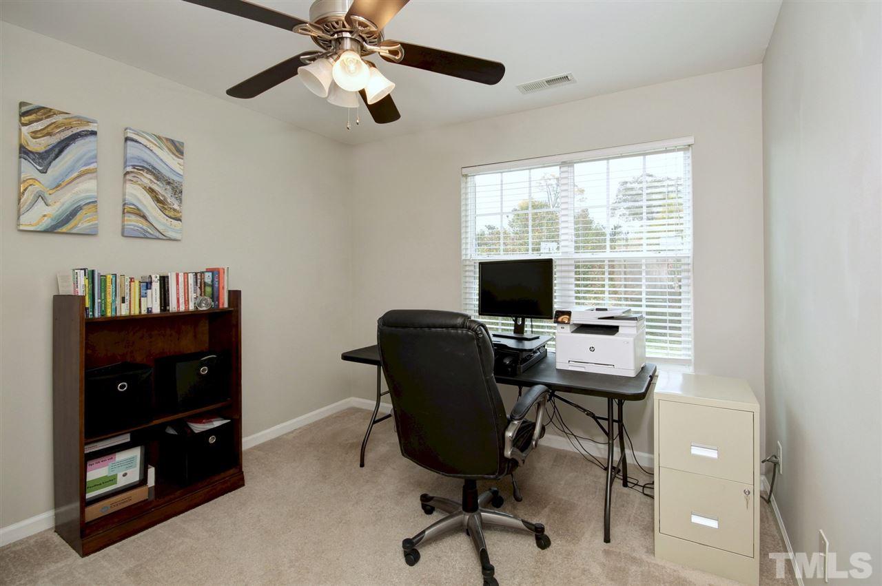 927 Ileagnes Road Raleigh, NC 27603 - Photo 17 of 26 a view of a workspace with furniture and a window