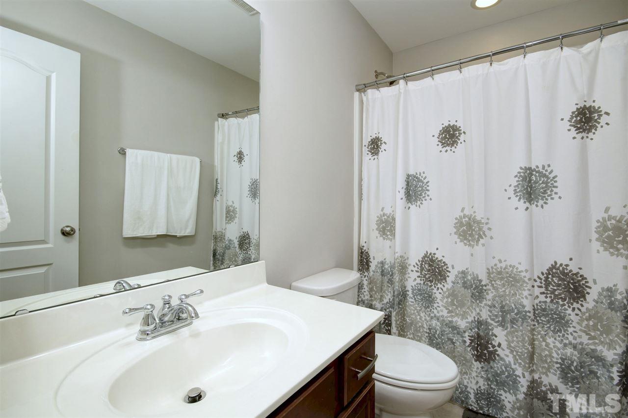 927 Ileagnes Road Raleigh, NC 27603 - Photo 26 of 26 a bathroom with a sink a toilet and shower