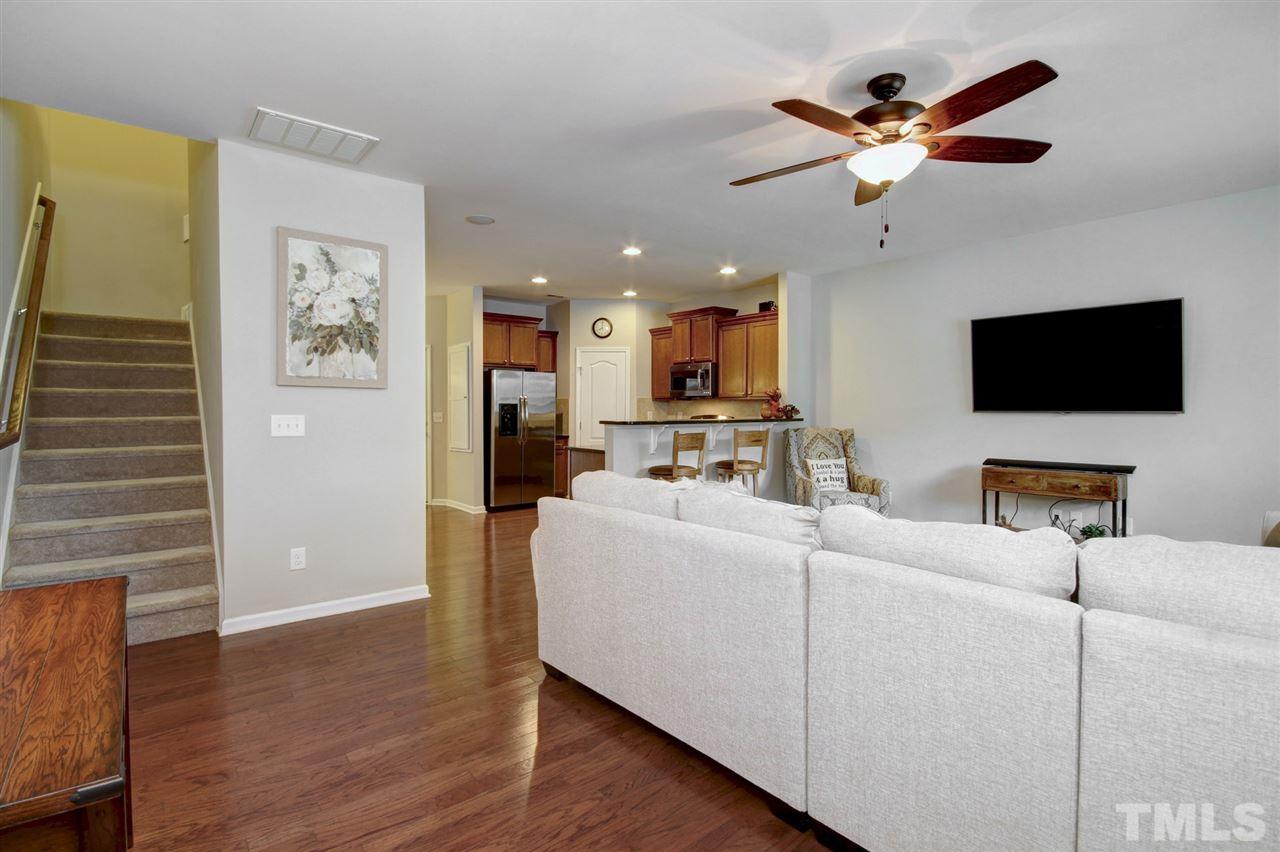 927 Ileagnes Road Raleigh, NC 27603 - Photo 5 of 26 a living room with furniture and a flat screen tv