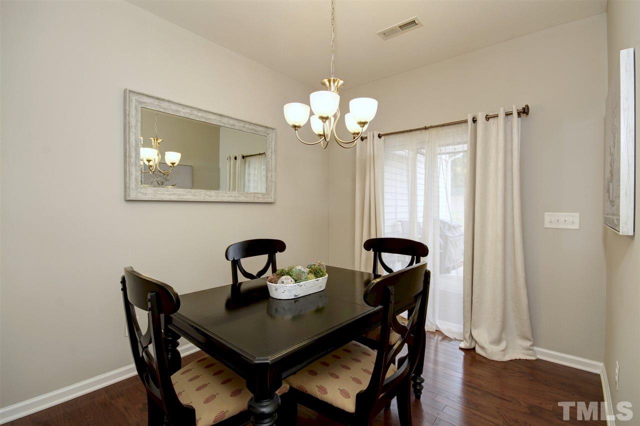 927 Ileagnes Road Raleigh, NC 27603 - Photo 7 of 26 a view of a dining room with a table and chairs